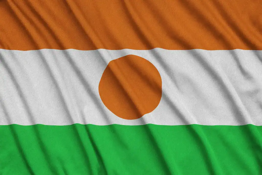 The flag of Niger, featuring horizontal orange, white, and green stripes with an orange circle in the center, is as recognizable as finding the right immigration lawyer in Orlando for your journey.