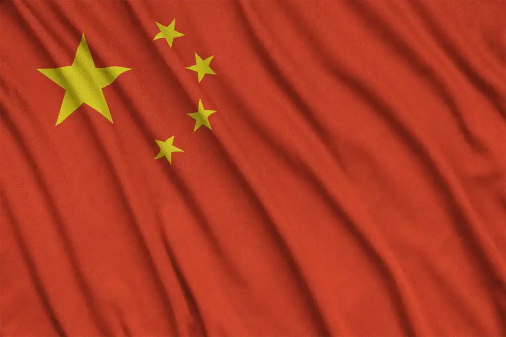 The flag of China, often recognized by immigration lawyer in Orlando, features a large yellow star and four smaller stars on a vibrant red background.